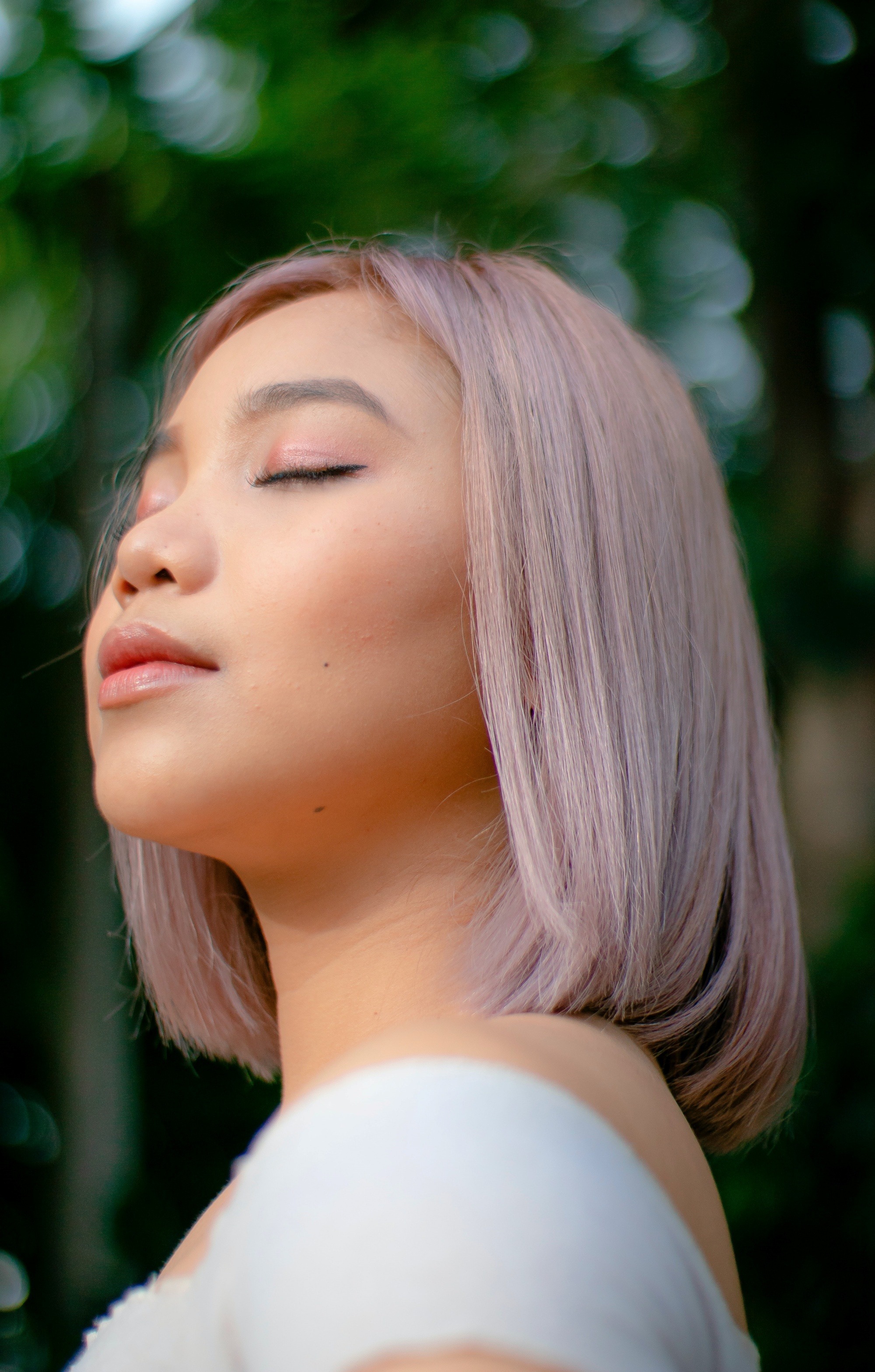 Asian woman with ash pink hair