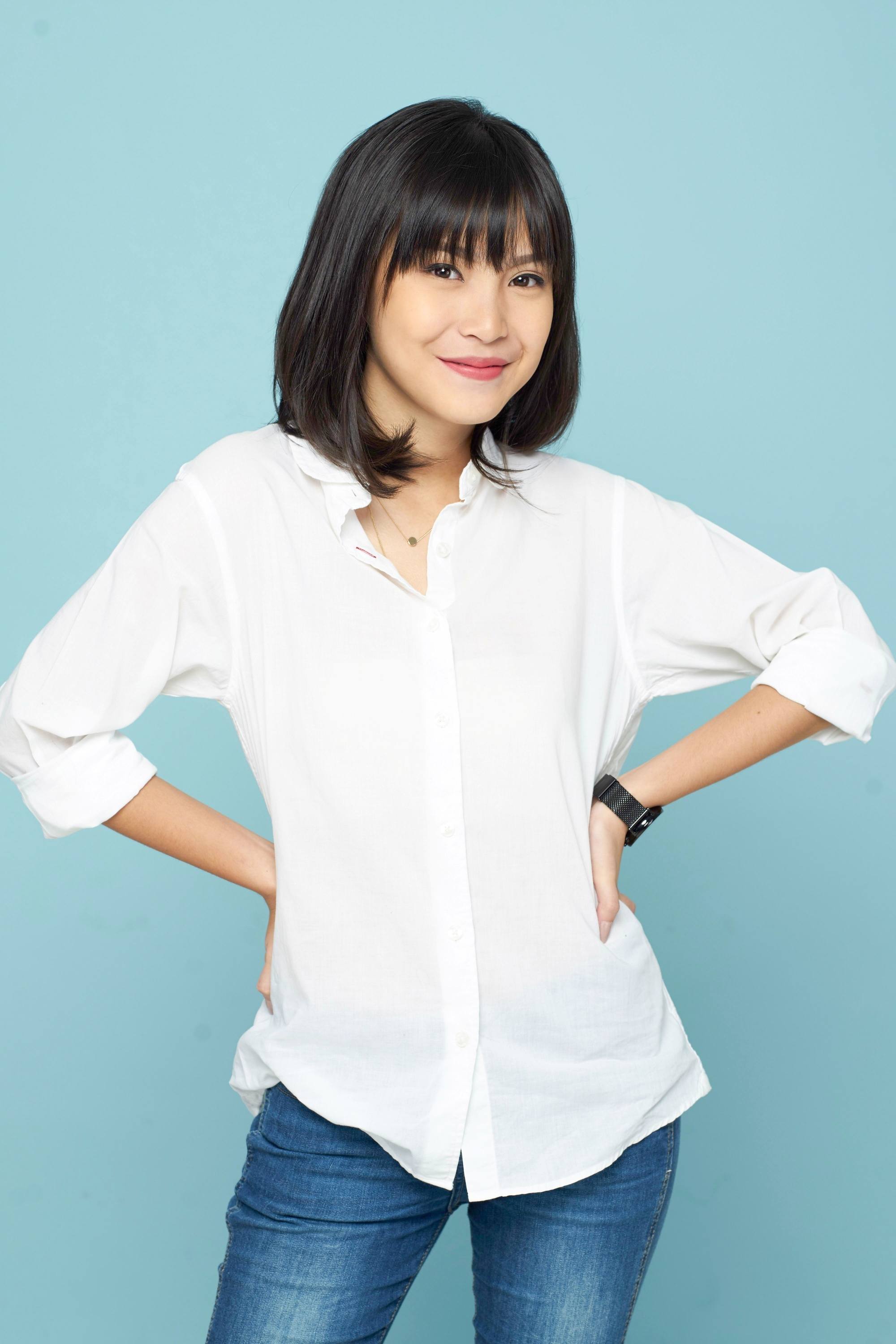 Asian woman with fine thin hair wearing a white blouse