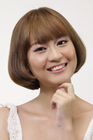 Asian woman with short hair and bangs
