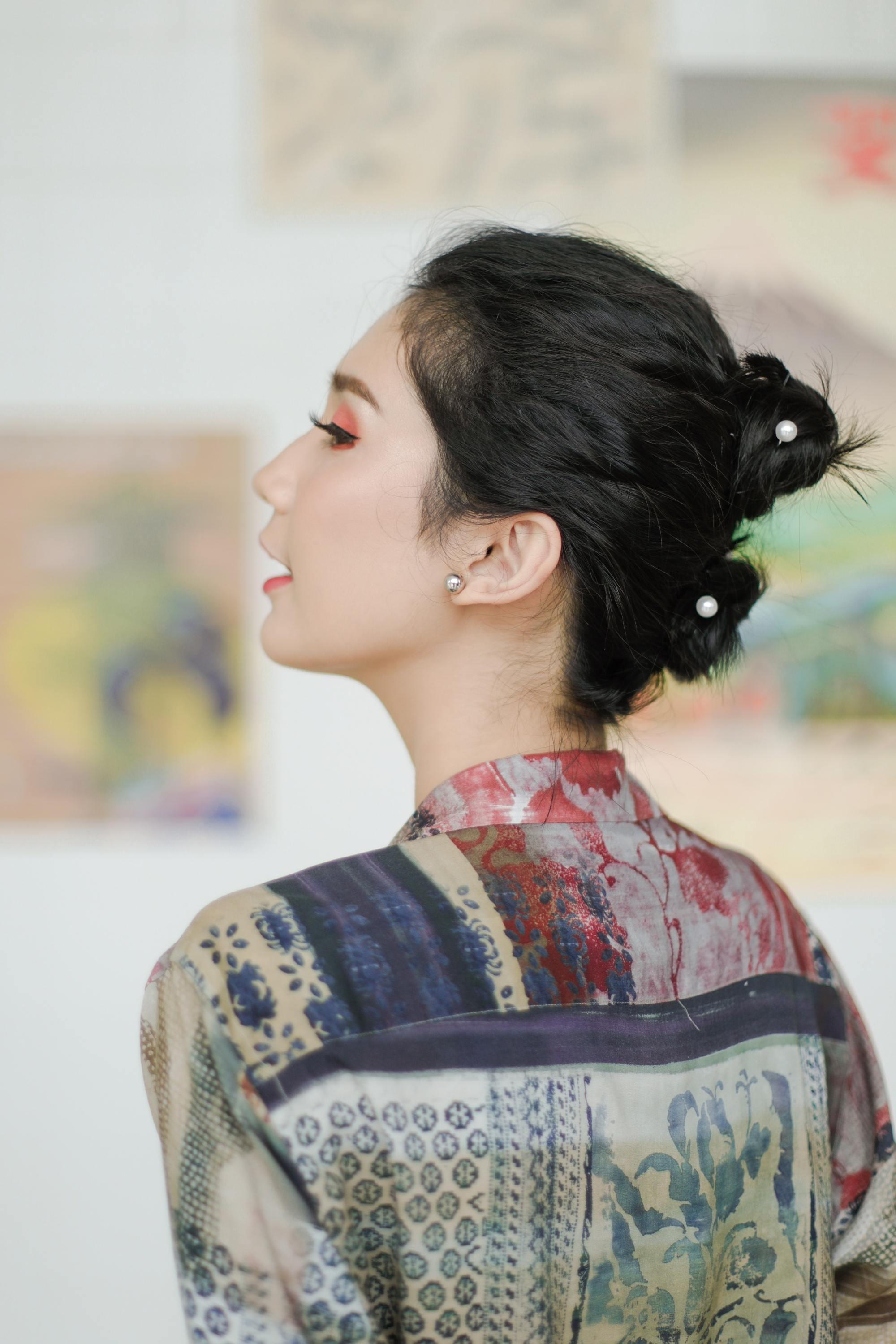 Asian woman with double stacked buns for short hair