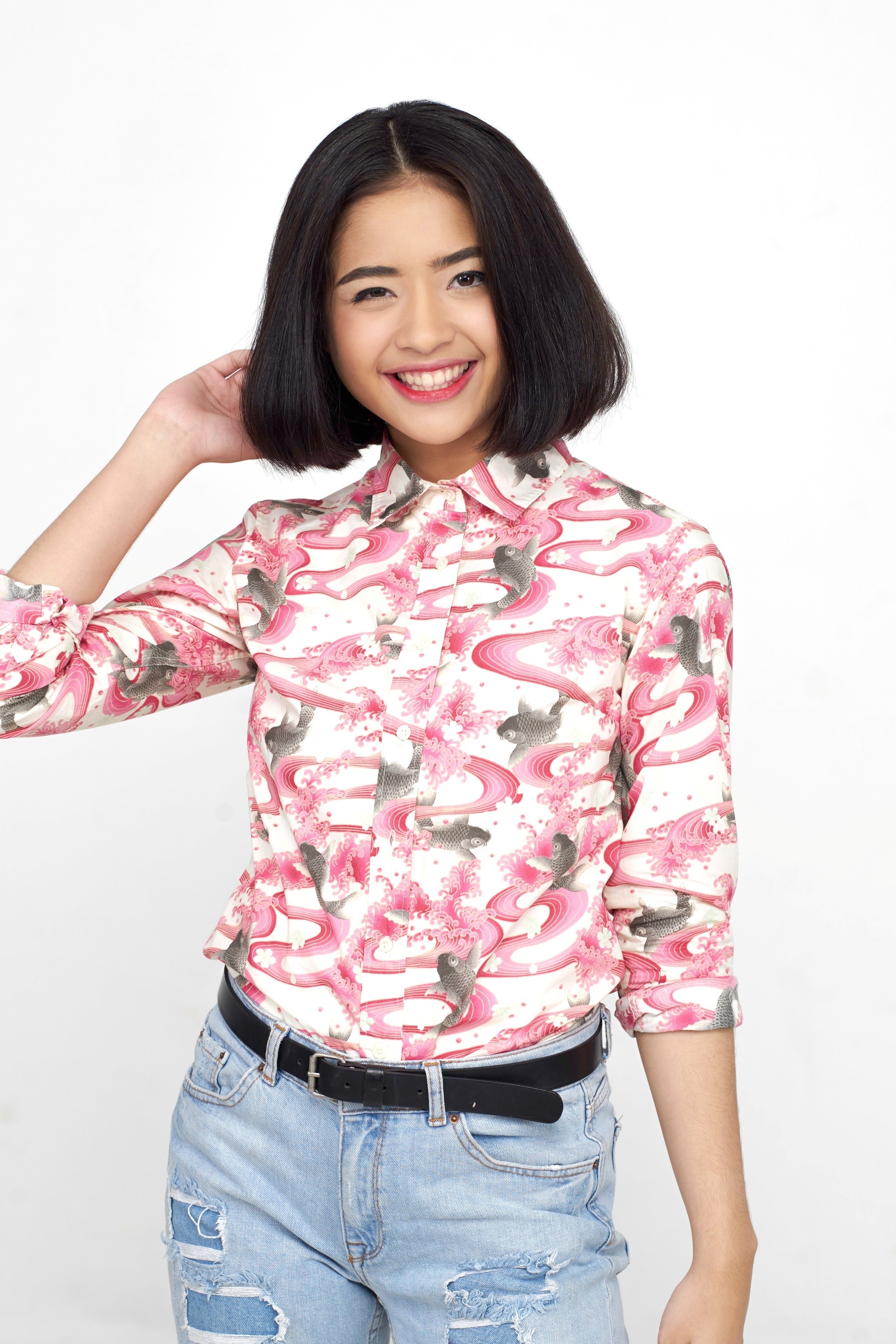 Asian woman with short hair wearing a pink blouse