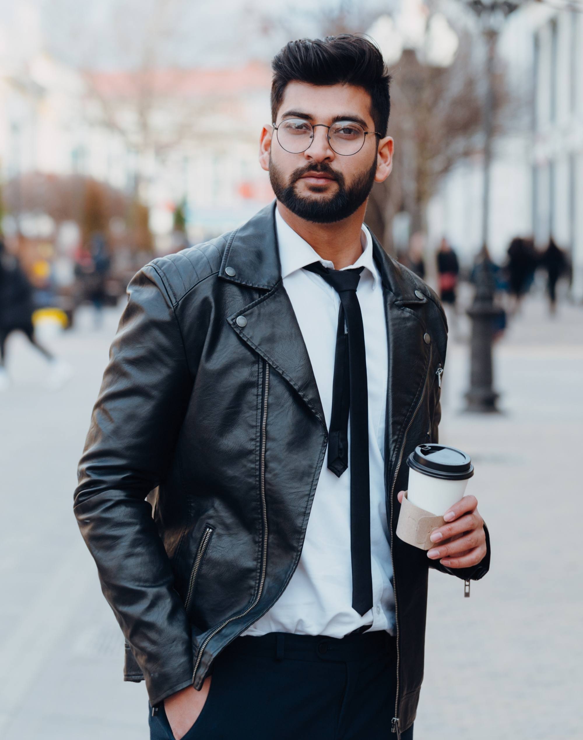 Asian man with a beard wearing a black jacket
