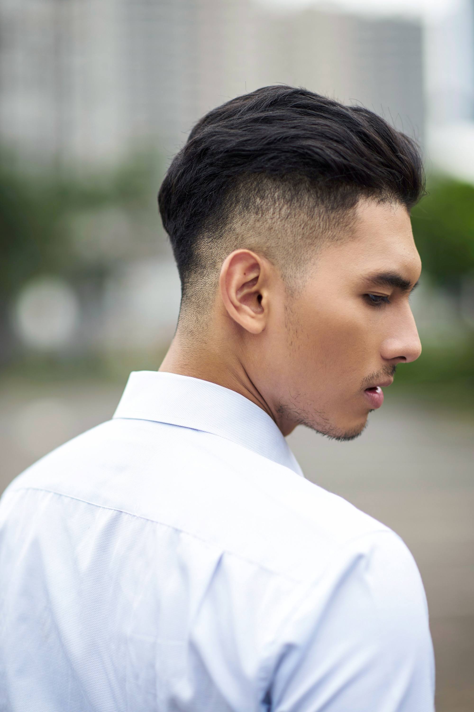 Asian man with short hair with shaved sides