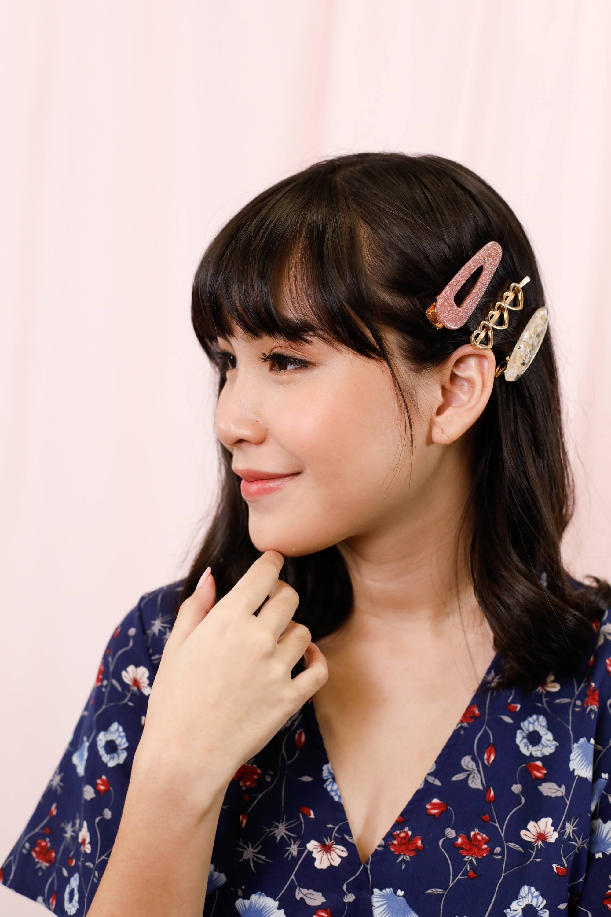 Asian woman wearing hair clips