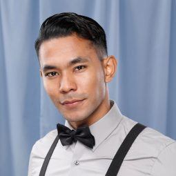 Asian man with a disconnected undercut wearing a bow tie