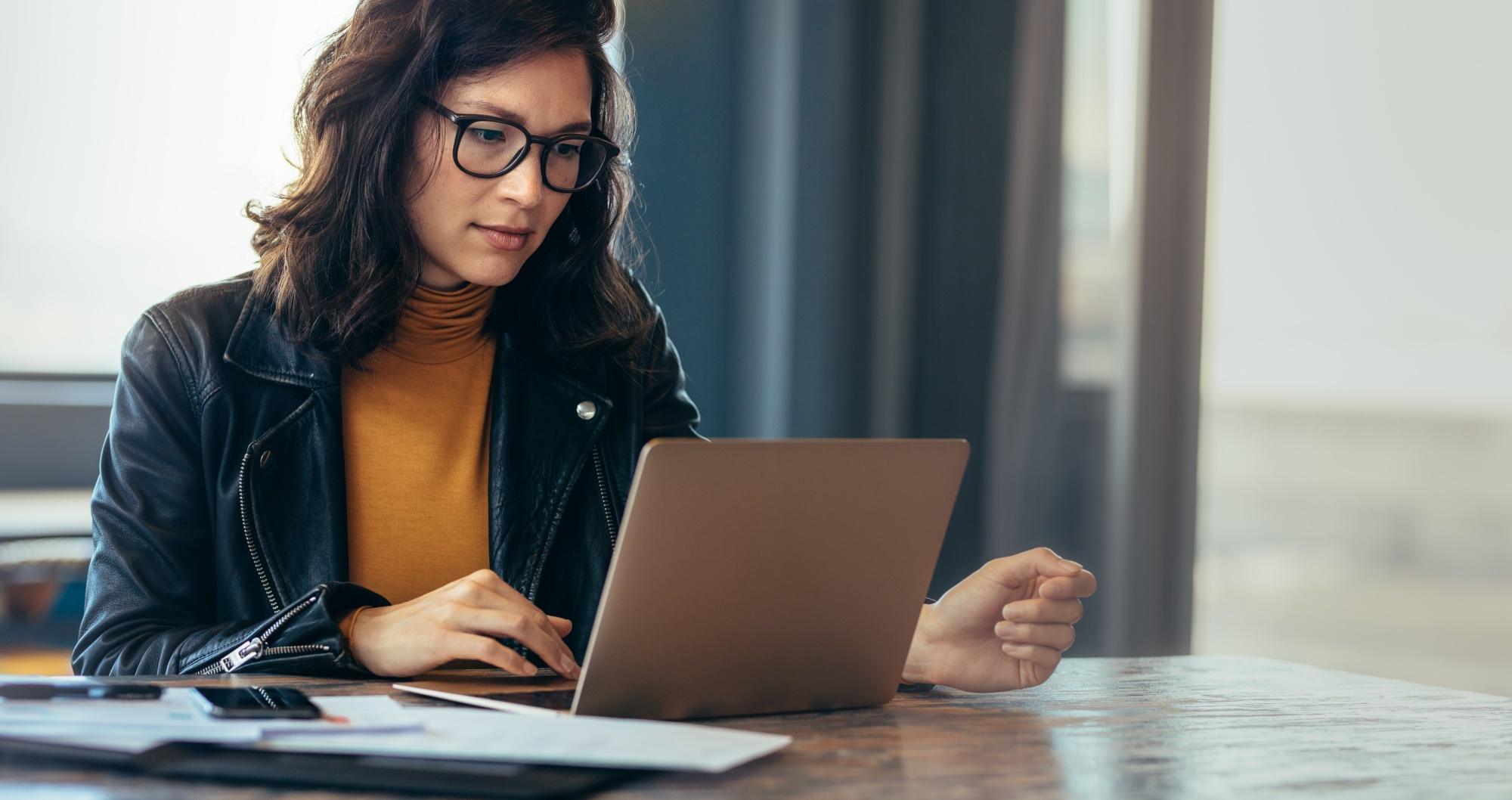 Asian woman using a laptop in an office