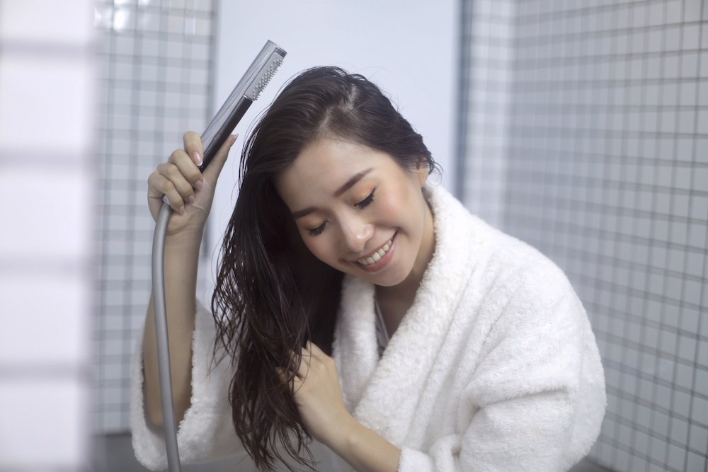 Asian woman washing her hair