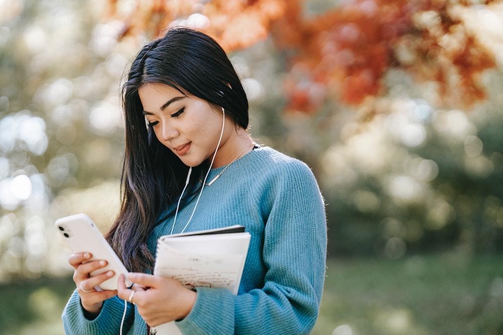 Asian woman checking her phone