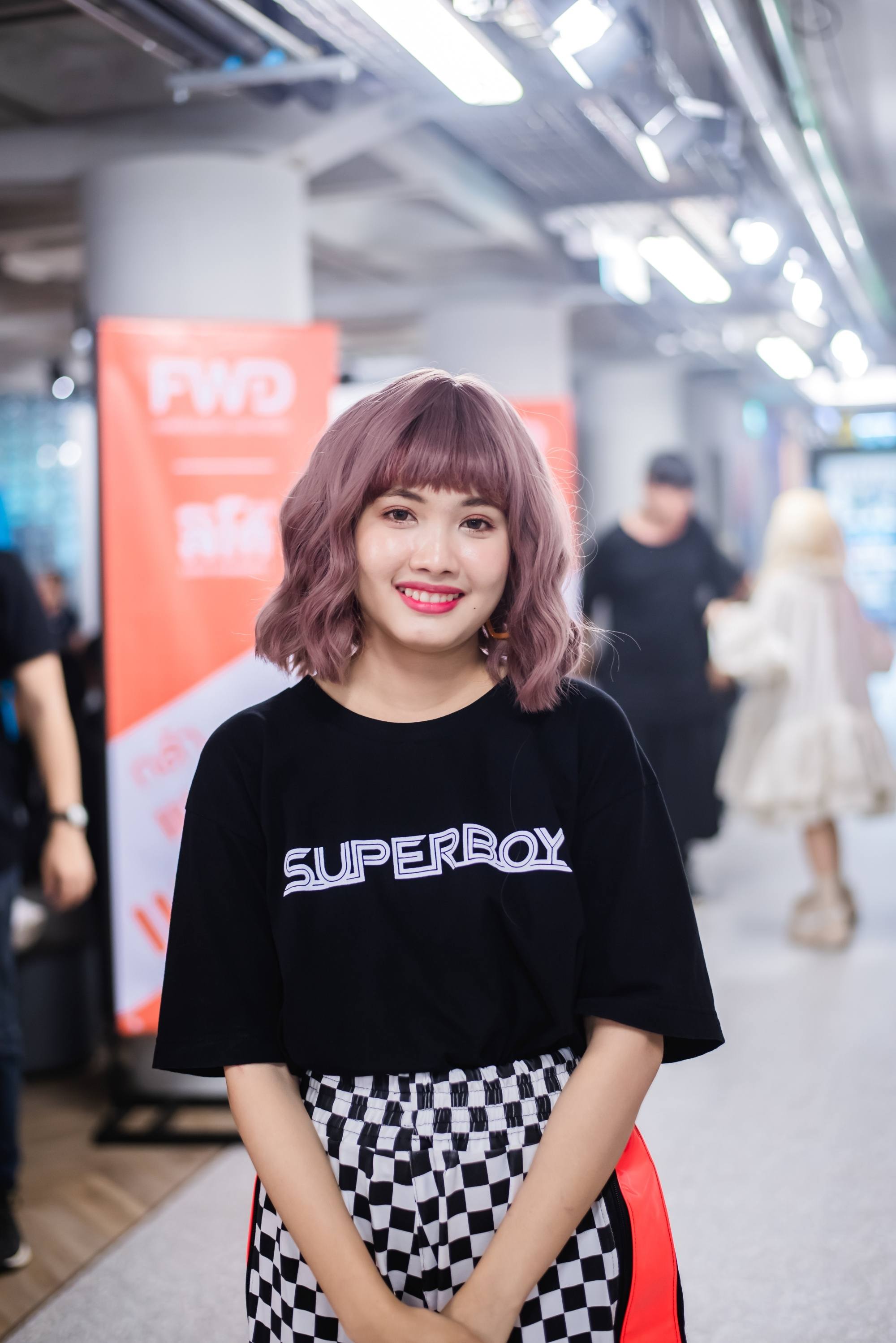 Asian woman with short purple hair with bangs for round face