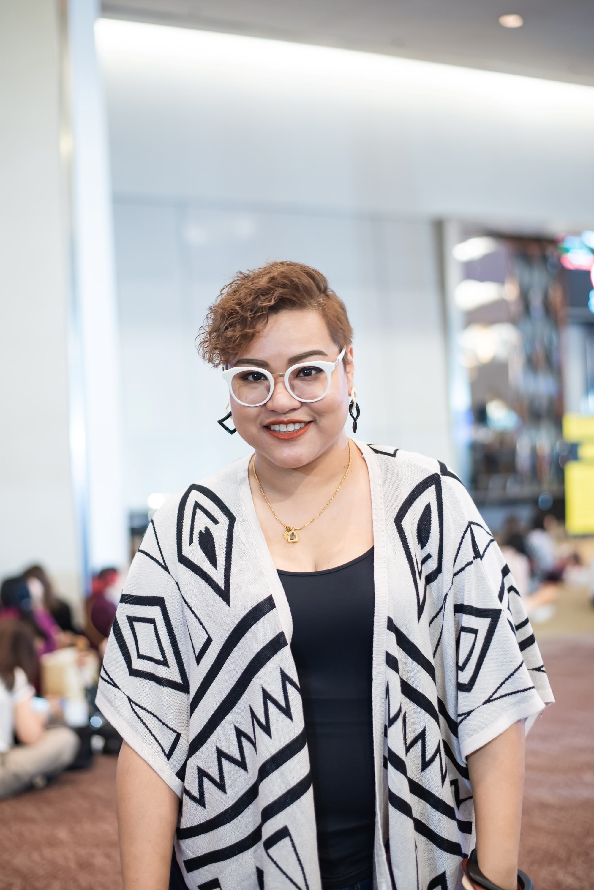 Asian woman with amber brown curly hair color