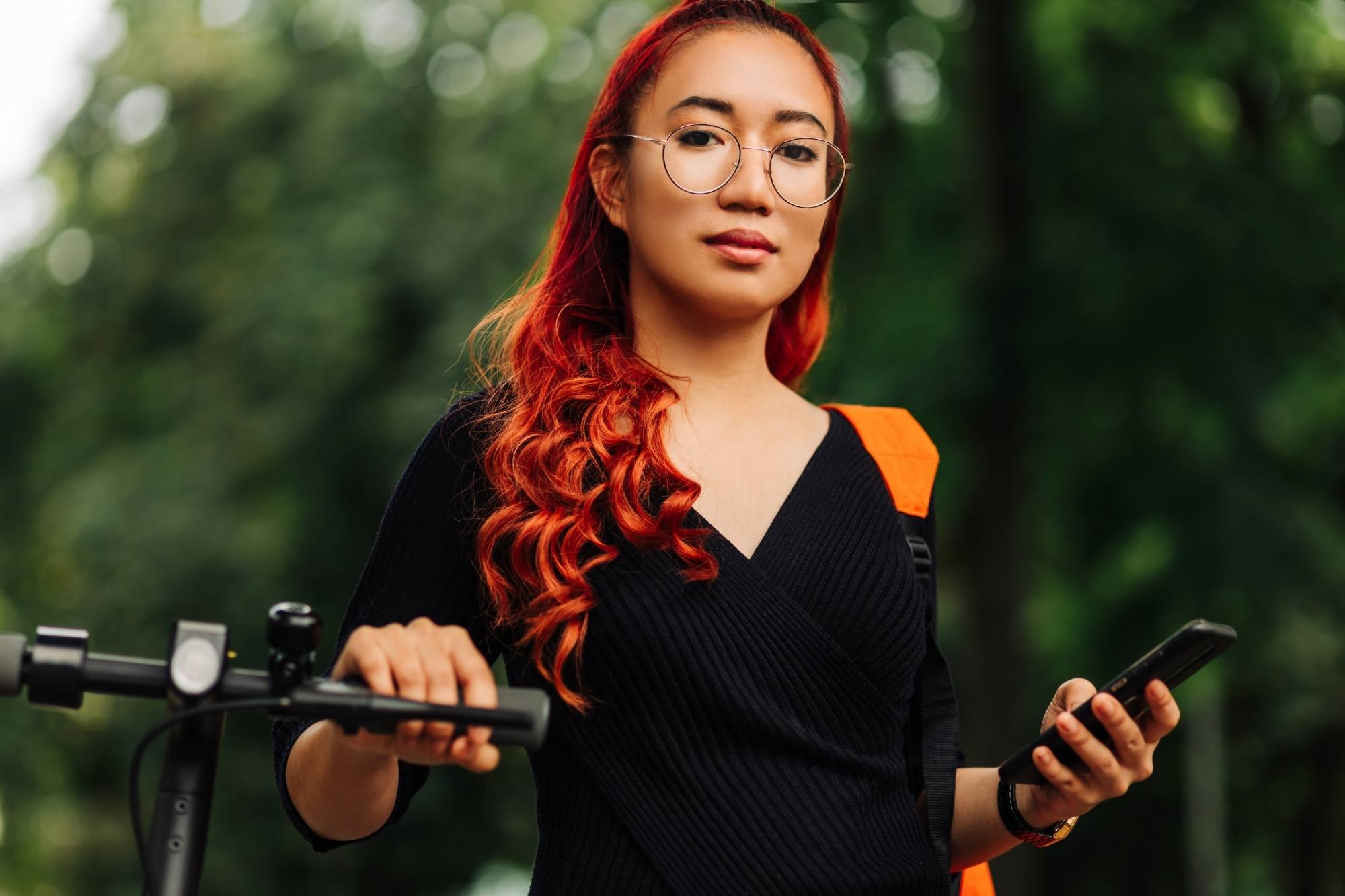 Asian woman with red orange curly hair color