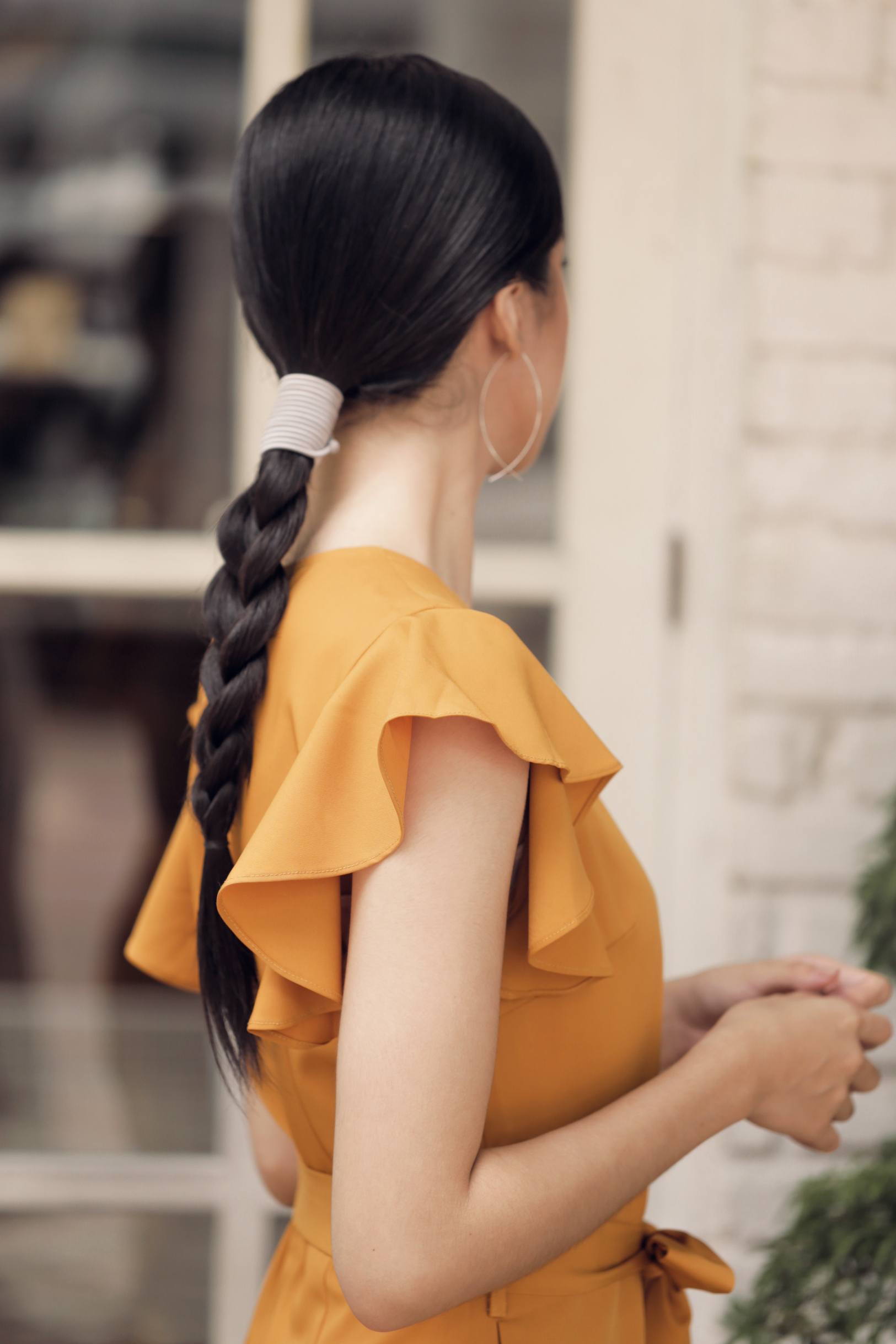 Asian woman with a braided hairstyle for long hair
