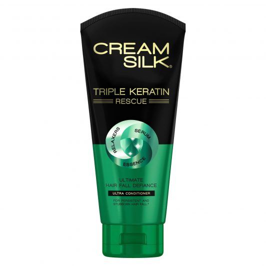 Bottle of Cream Silk Triple Keratin Rescue Ultimate Hair Fall Defiance Ultra Conditioner