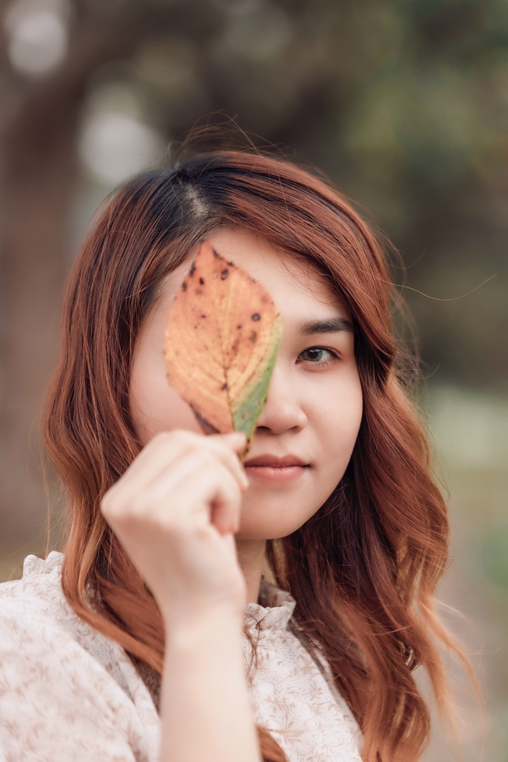 Asian woman with medium mahogany hair color
