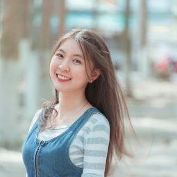 Hair Dye Ideas: Asian woman with long brown hair smiling