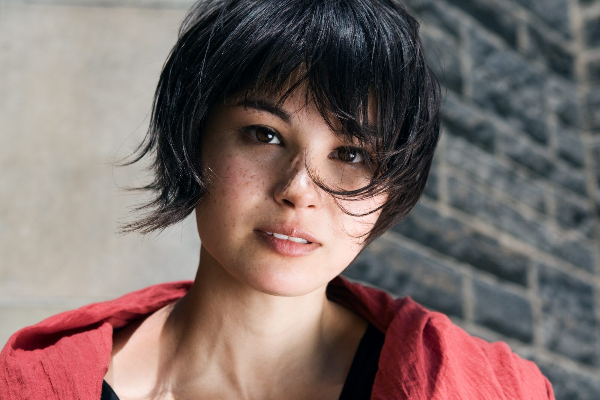 Asian woman with messy short hair
