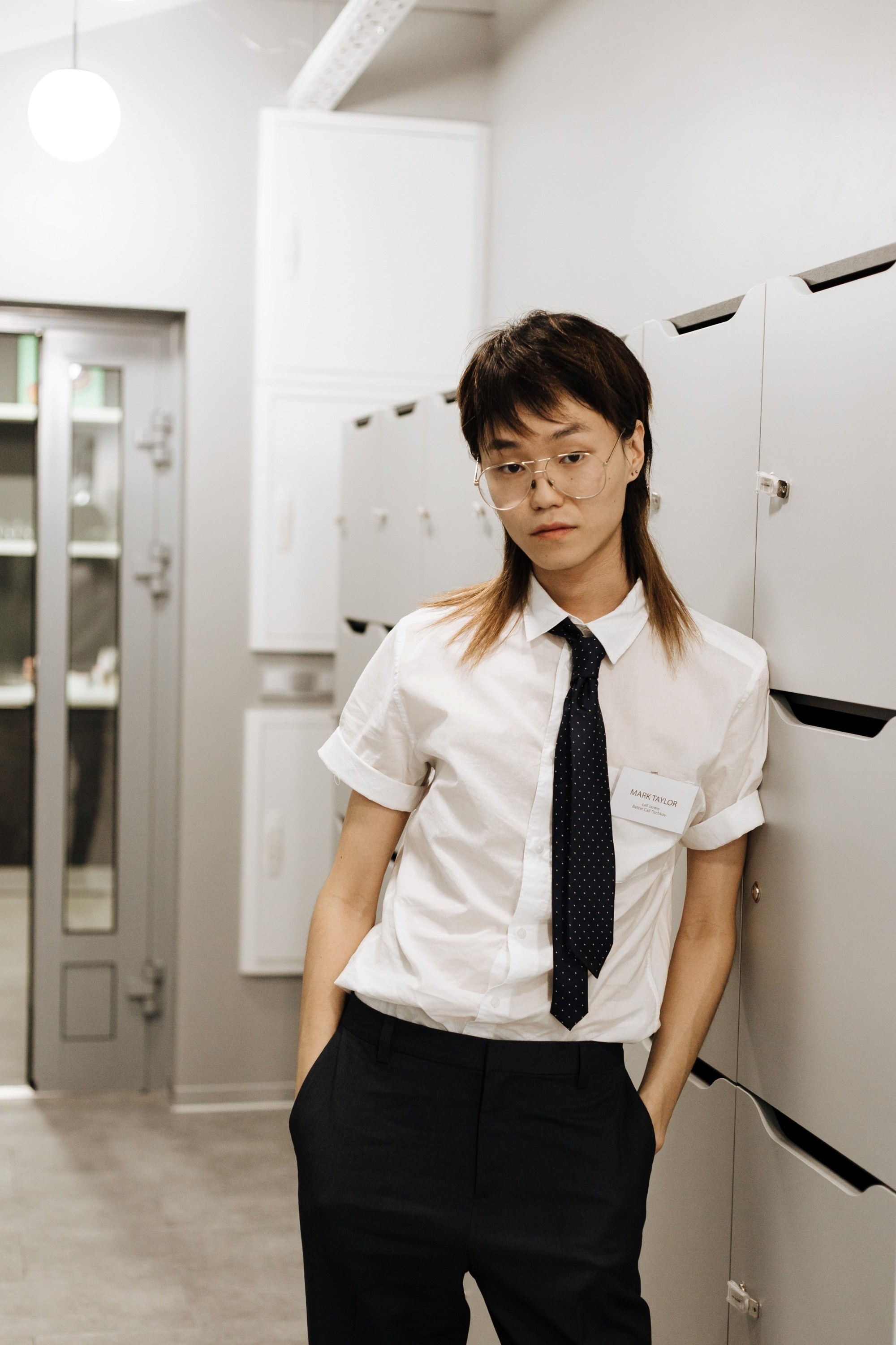 Asian woman with a long mullet androgynous haircut