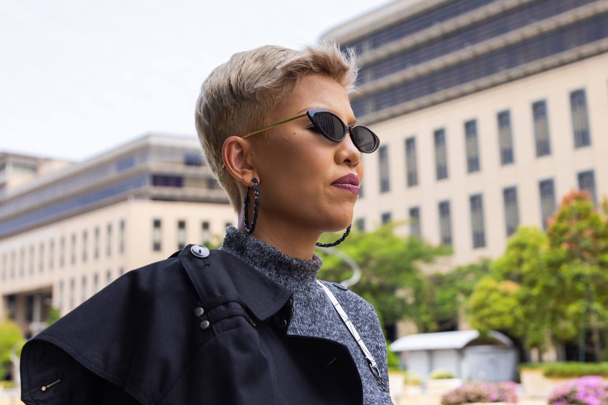 Woman with a blonde pixie cut with undercut