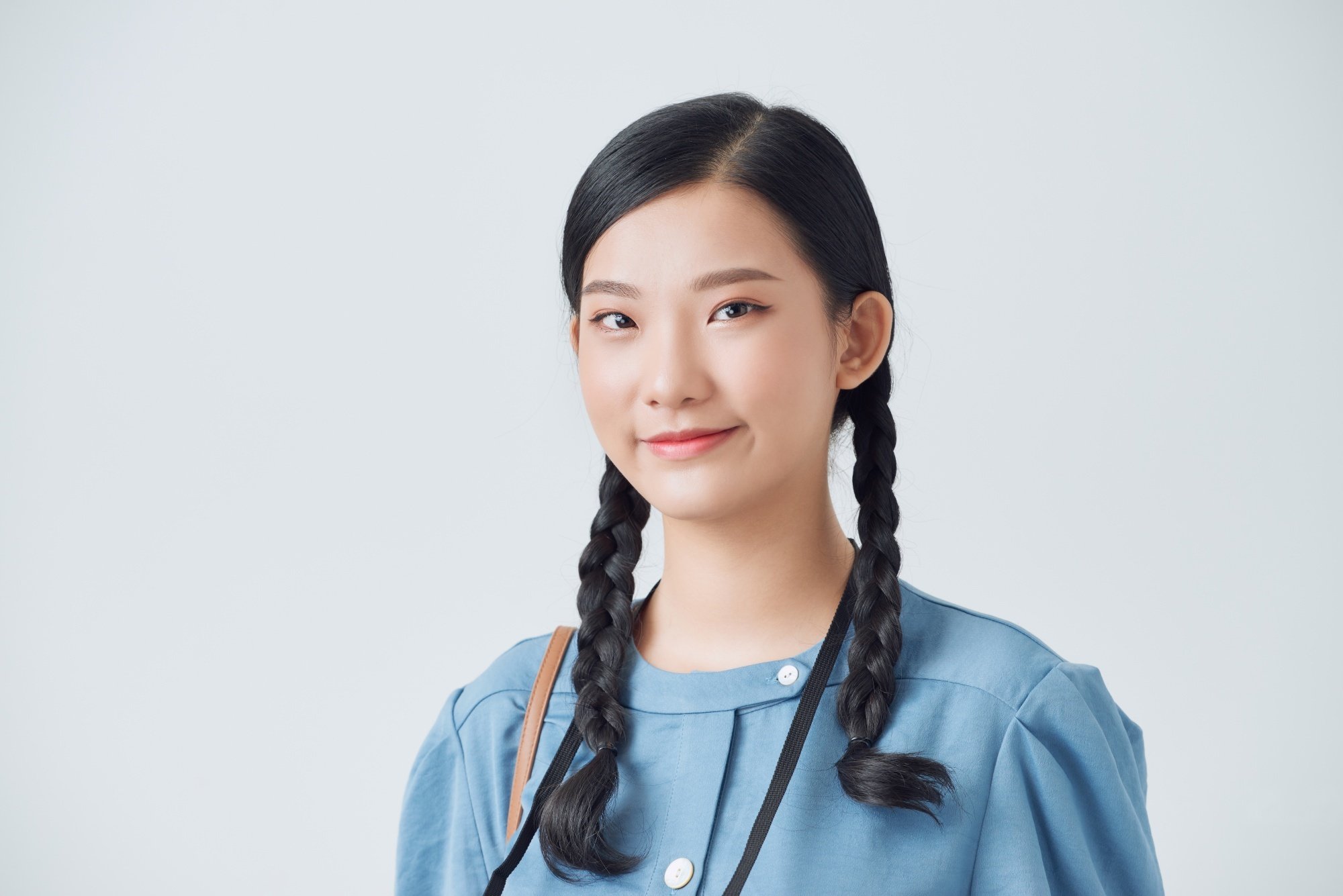 Asian woman with pigtail braids