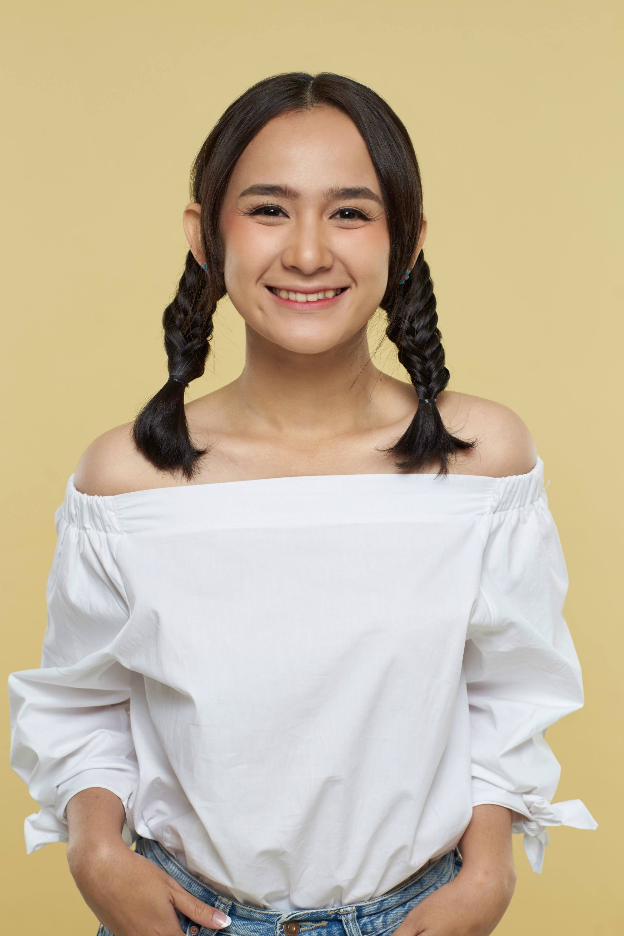 Asian woman with a twin fishtail braid hairstyle
