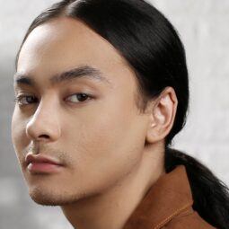 Asian man with a man ponytail hairstyle
