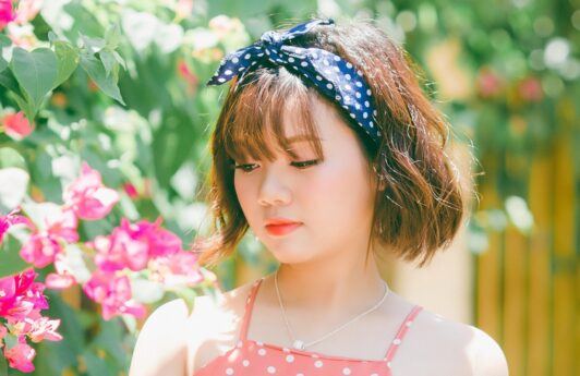 Asian woman with mahogany hair color for short hair