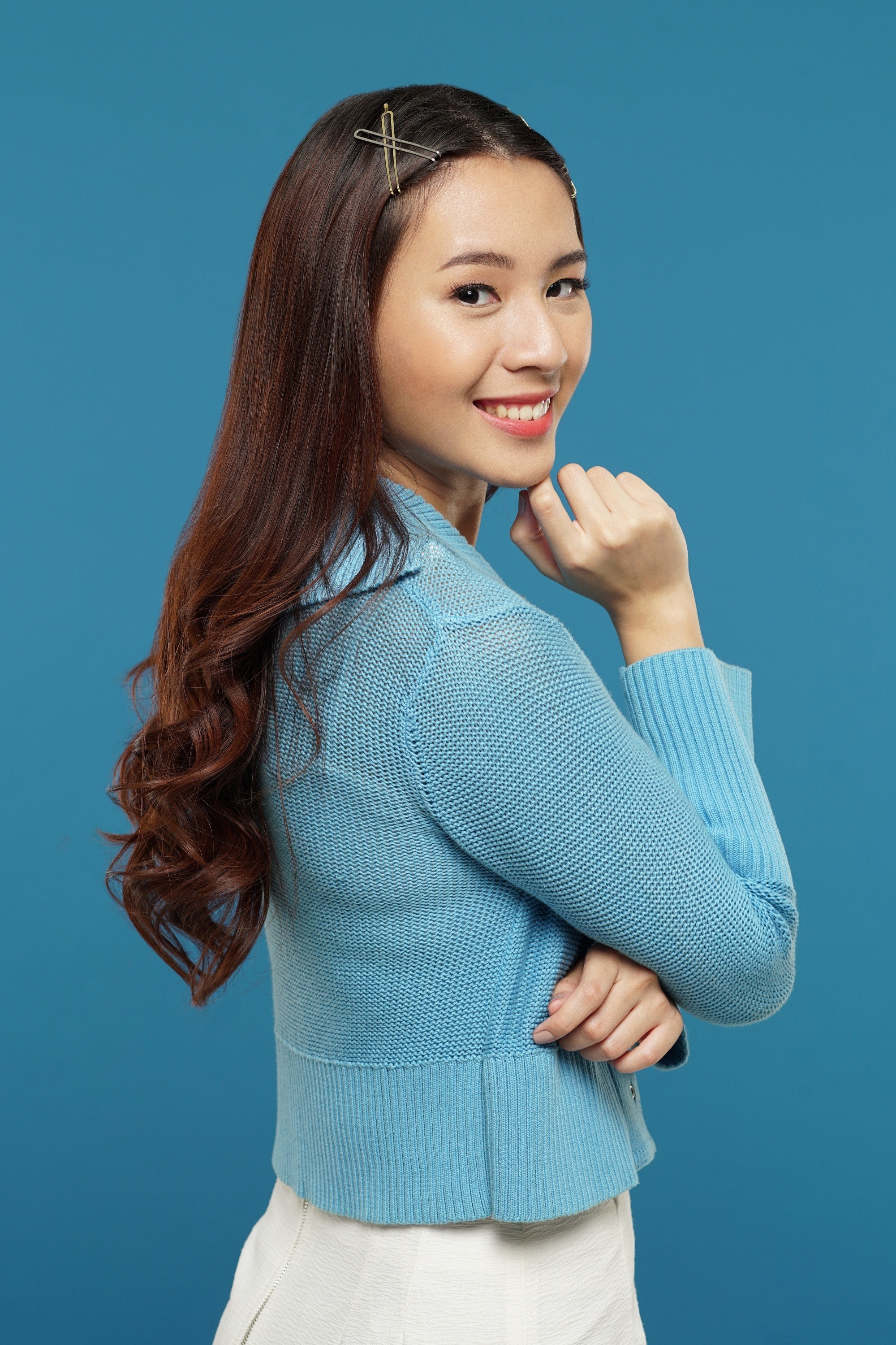 Asian woman with long hair wearing hair clips