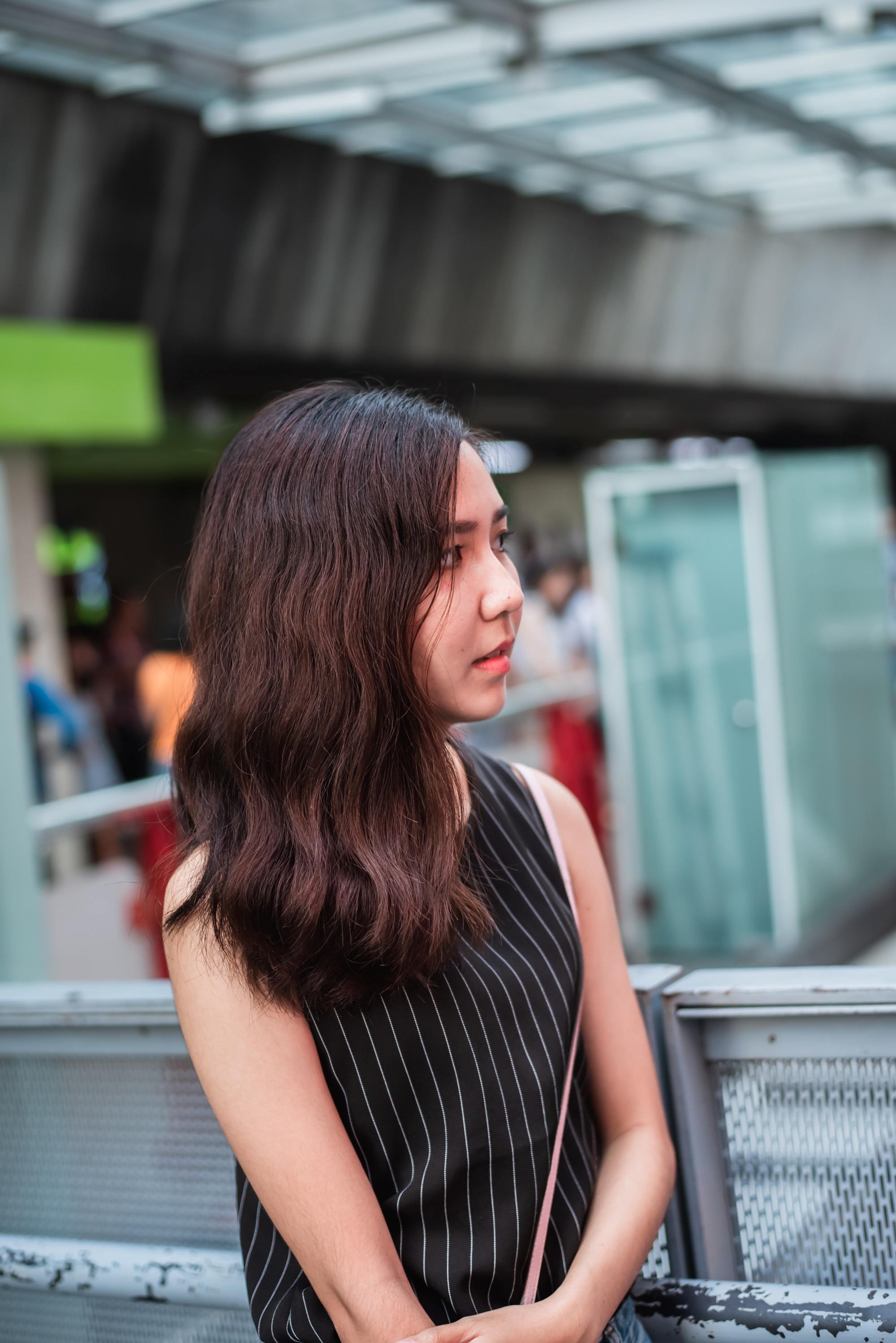 Asian woman with dark wavy u-cut hair