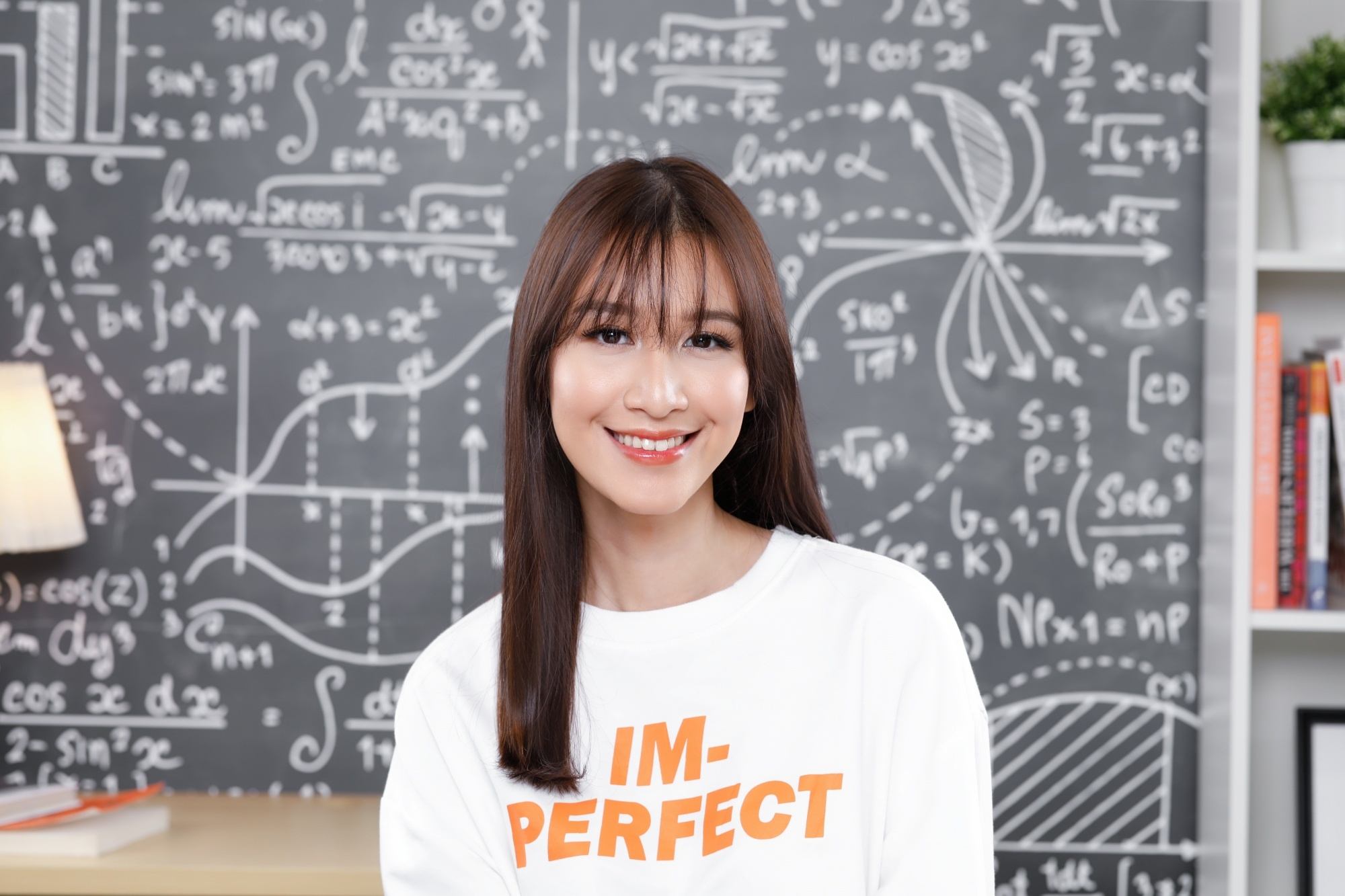 Asian woman with long straight hair and see-through bangs