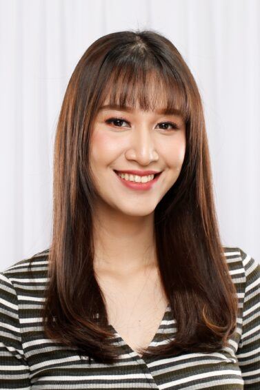 Asian woman with long straight hair with bangs