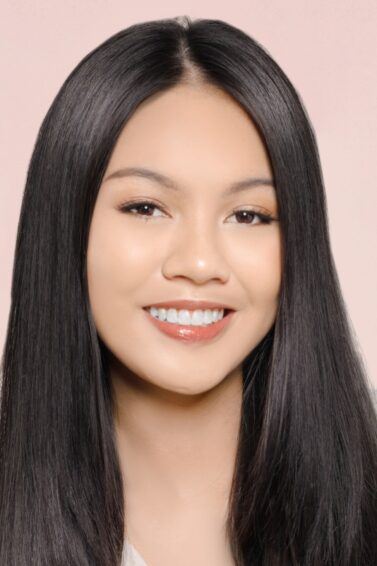 Asian woman with straight hair posing for a straightening shampoo and conditioner concept