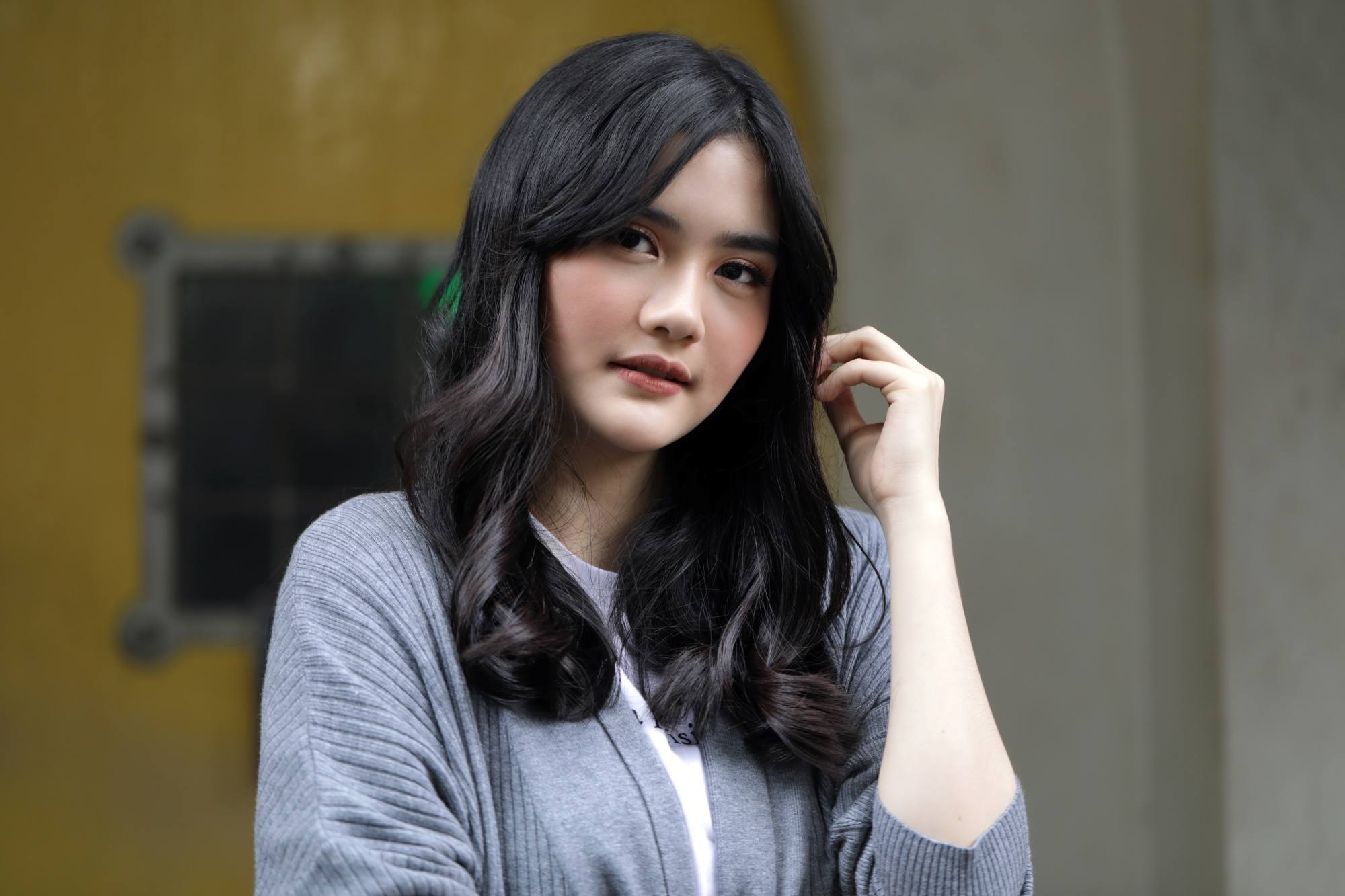Asian woman with long bangs and long hair