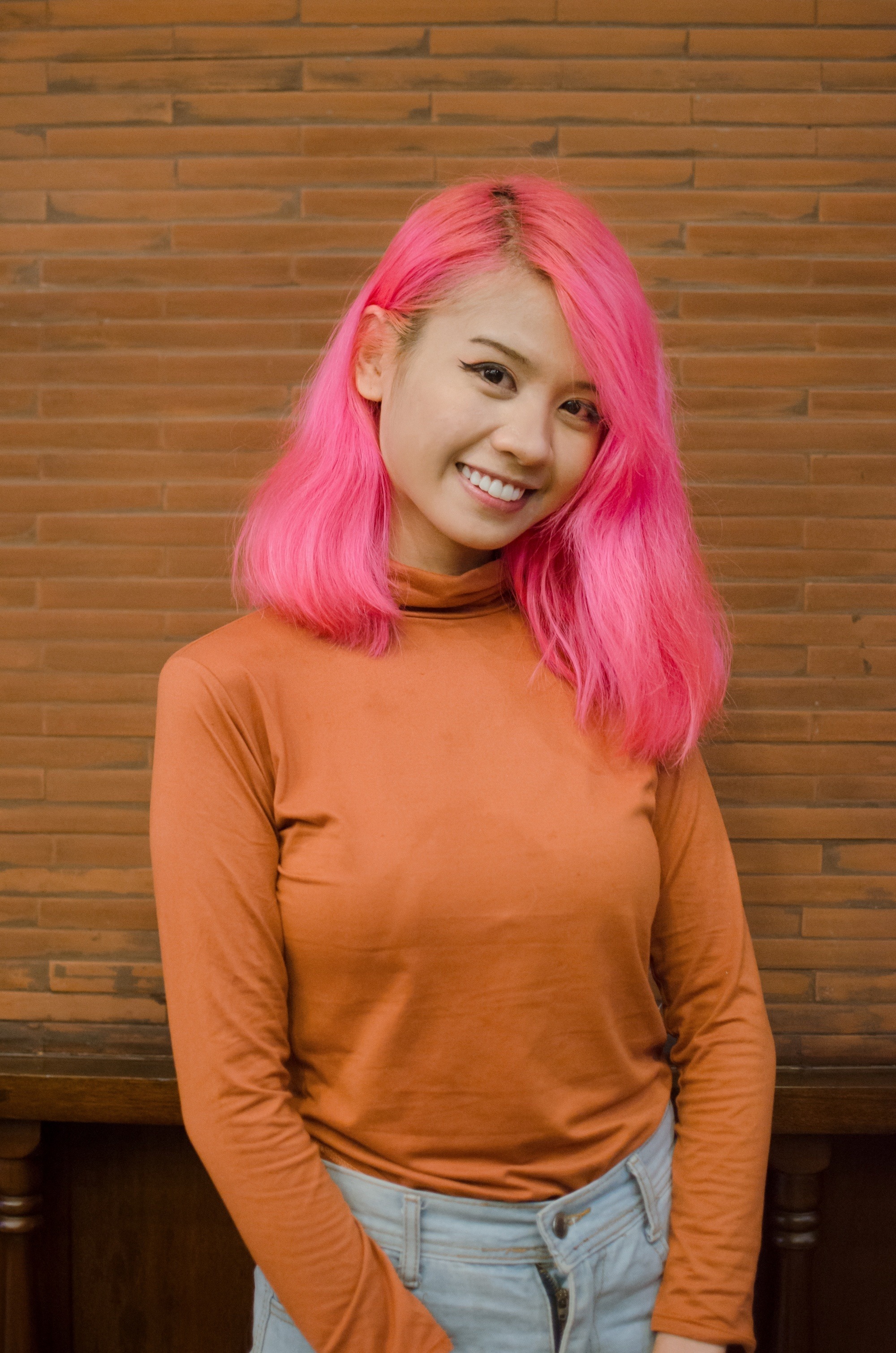 Filipina with bright pink e-girl aesthetic hair