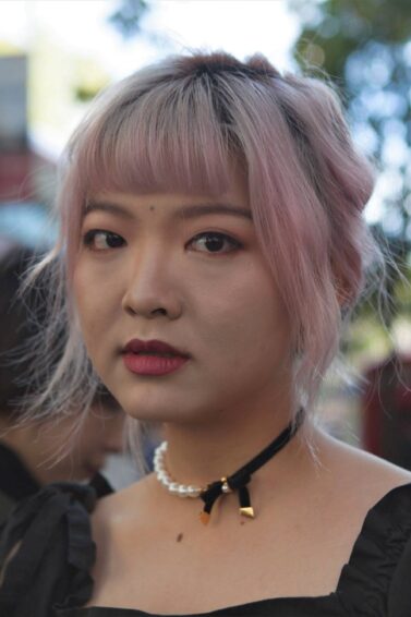 Asian woman with pink dust hair color
