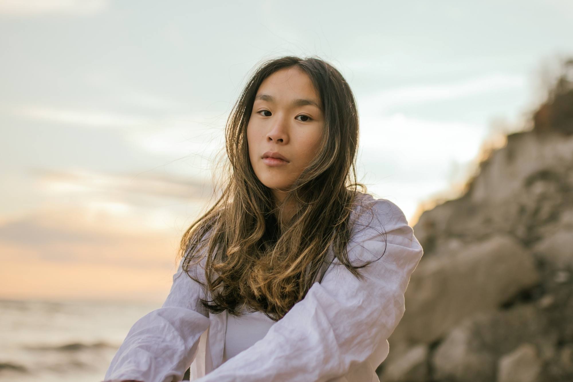 Asian woman with long layered hair