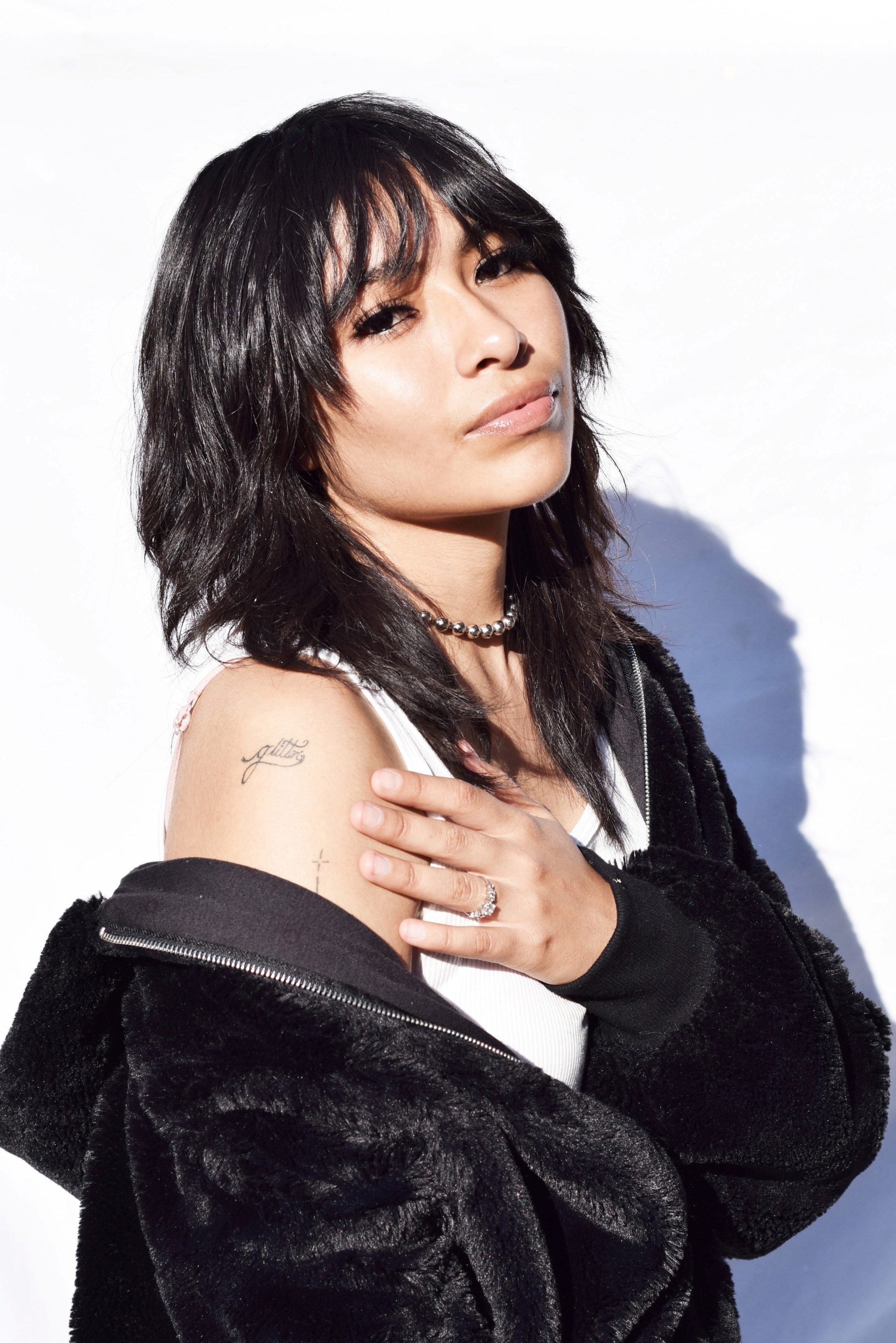 Woman with a wolf cut hairstyle with bangs