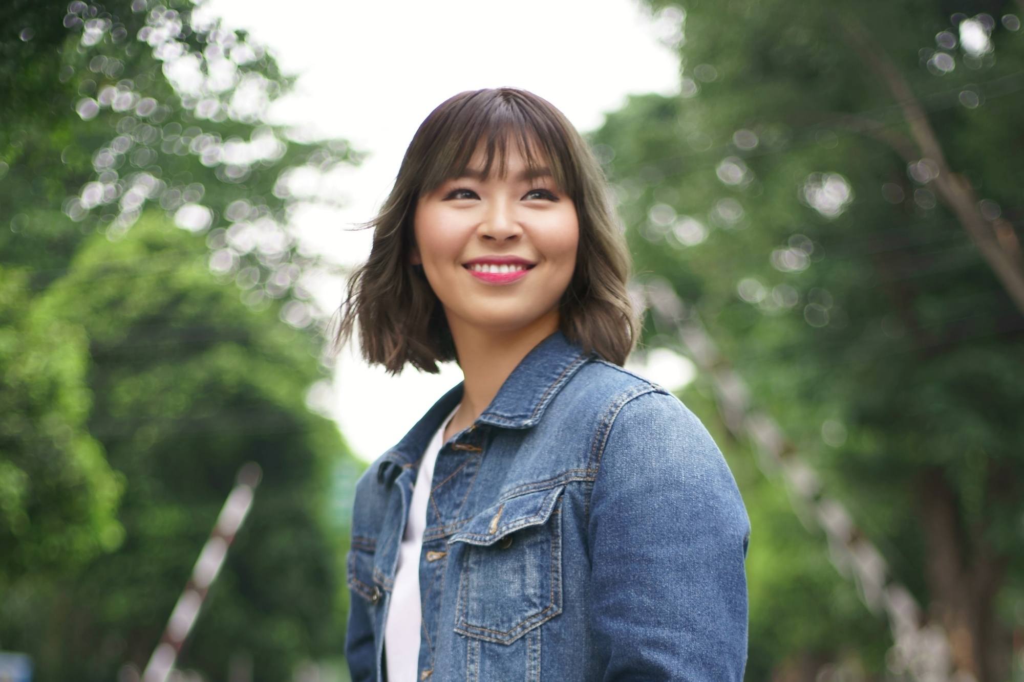 Asian woman with dark ash brown hair color