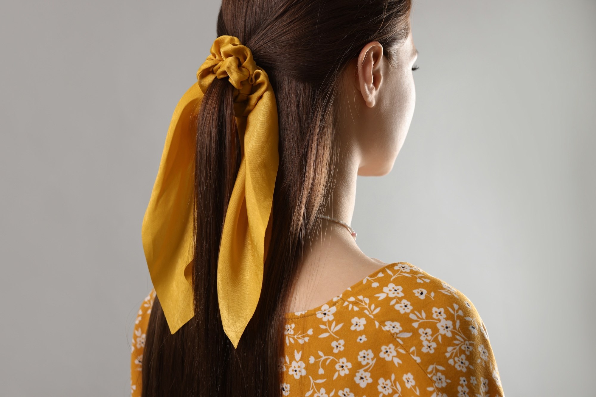 Woman with half updo tied by a bandana