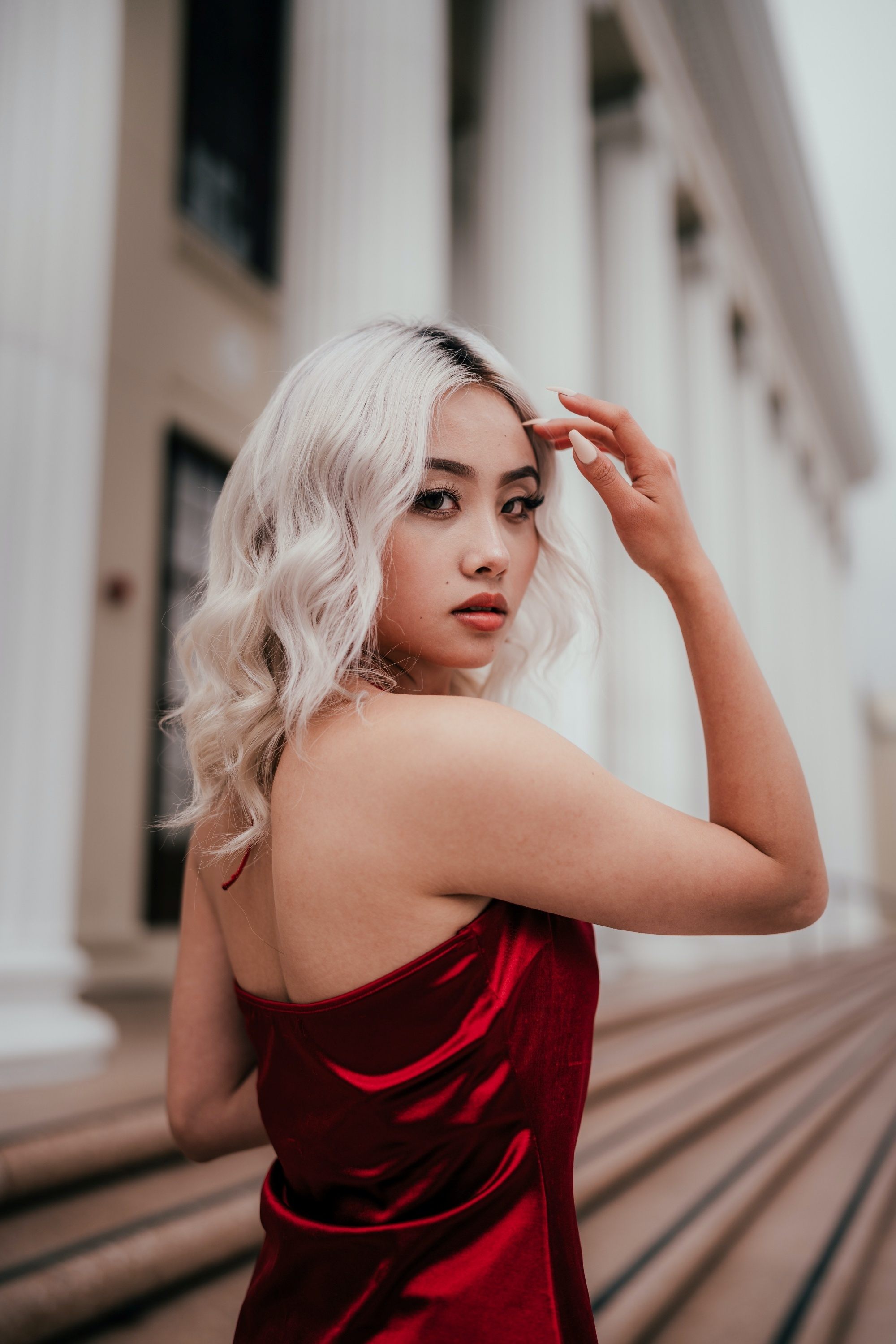 Asian woman with icy blonde hair color and morena skin