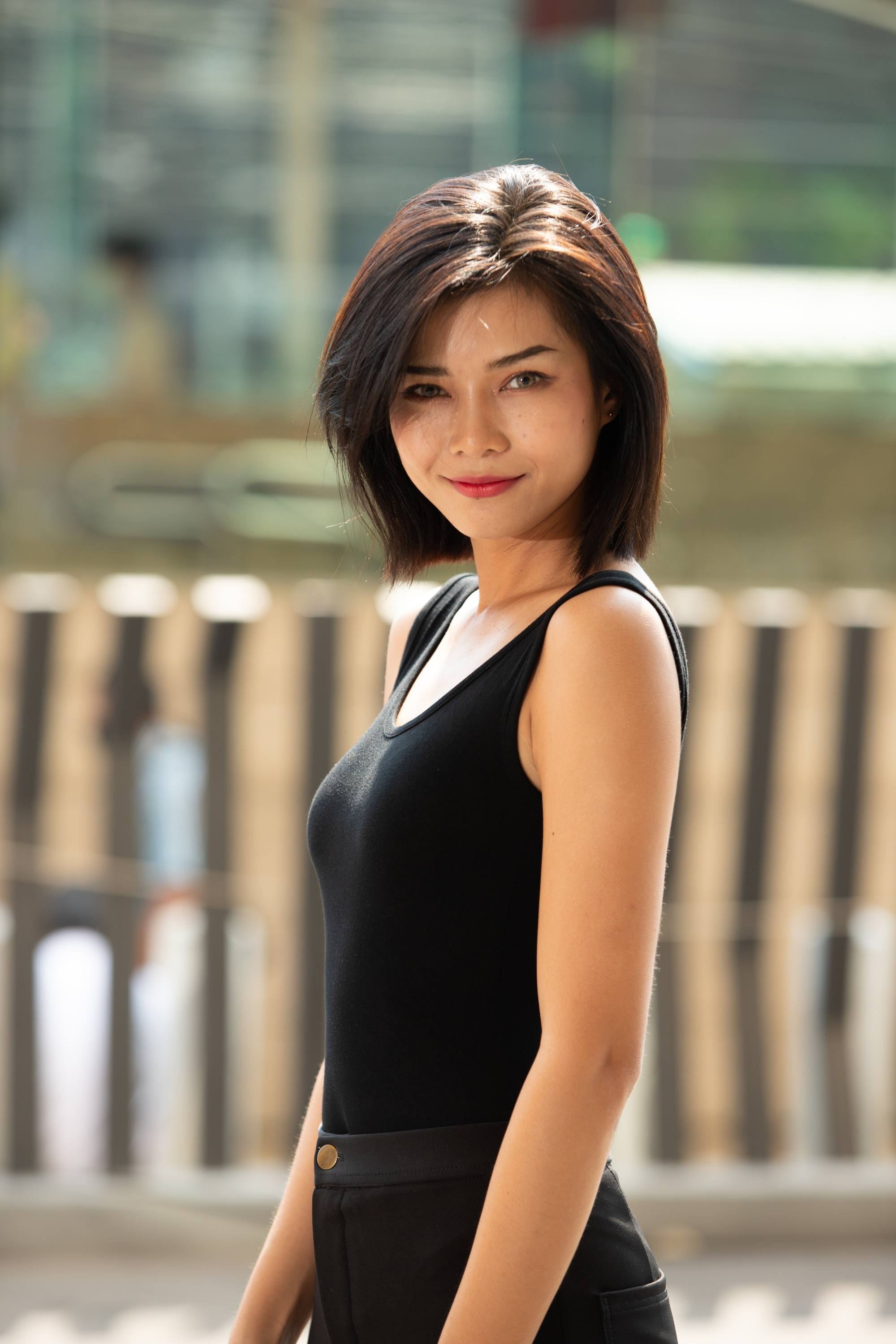 Asian woman with a bob haircut with side-swept bangs