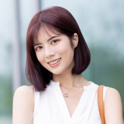 Asian woman with burgundy hair color