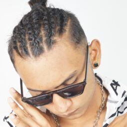 Asian man showing off a man braid hairstyle