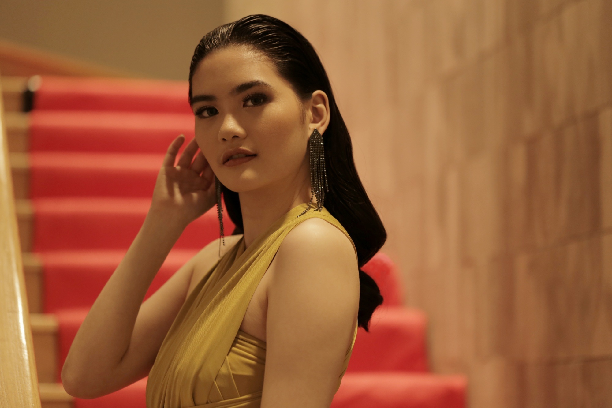 Asian woman with a voluminous slicked-back hairstyle for prom