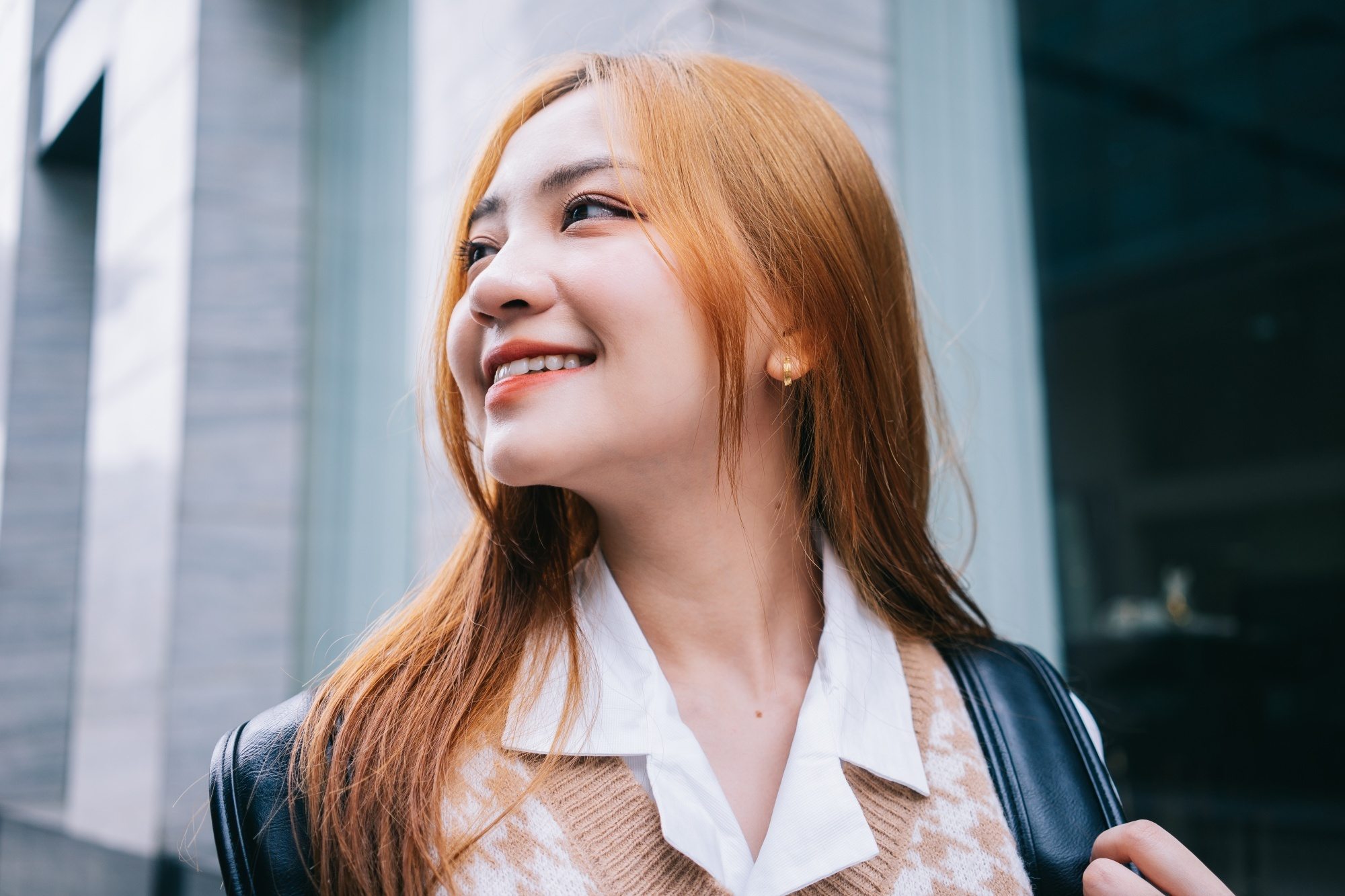 Asian woman with copper Korean hair color
