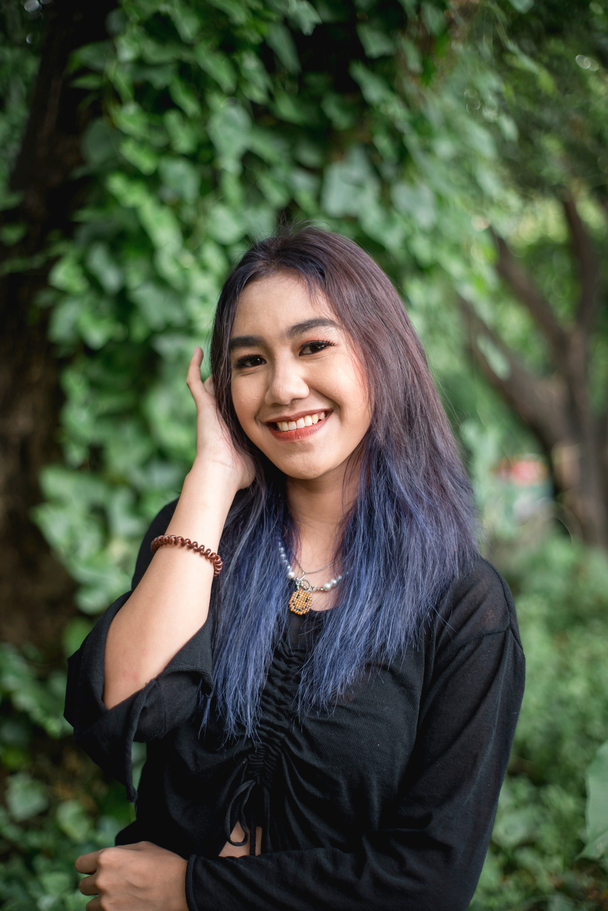 Asian woman with purple and blue hair