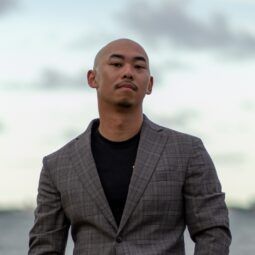 Asian man with a kalbo hairstyle wearing a suit