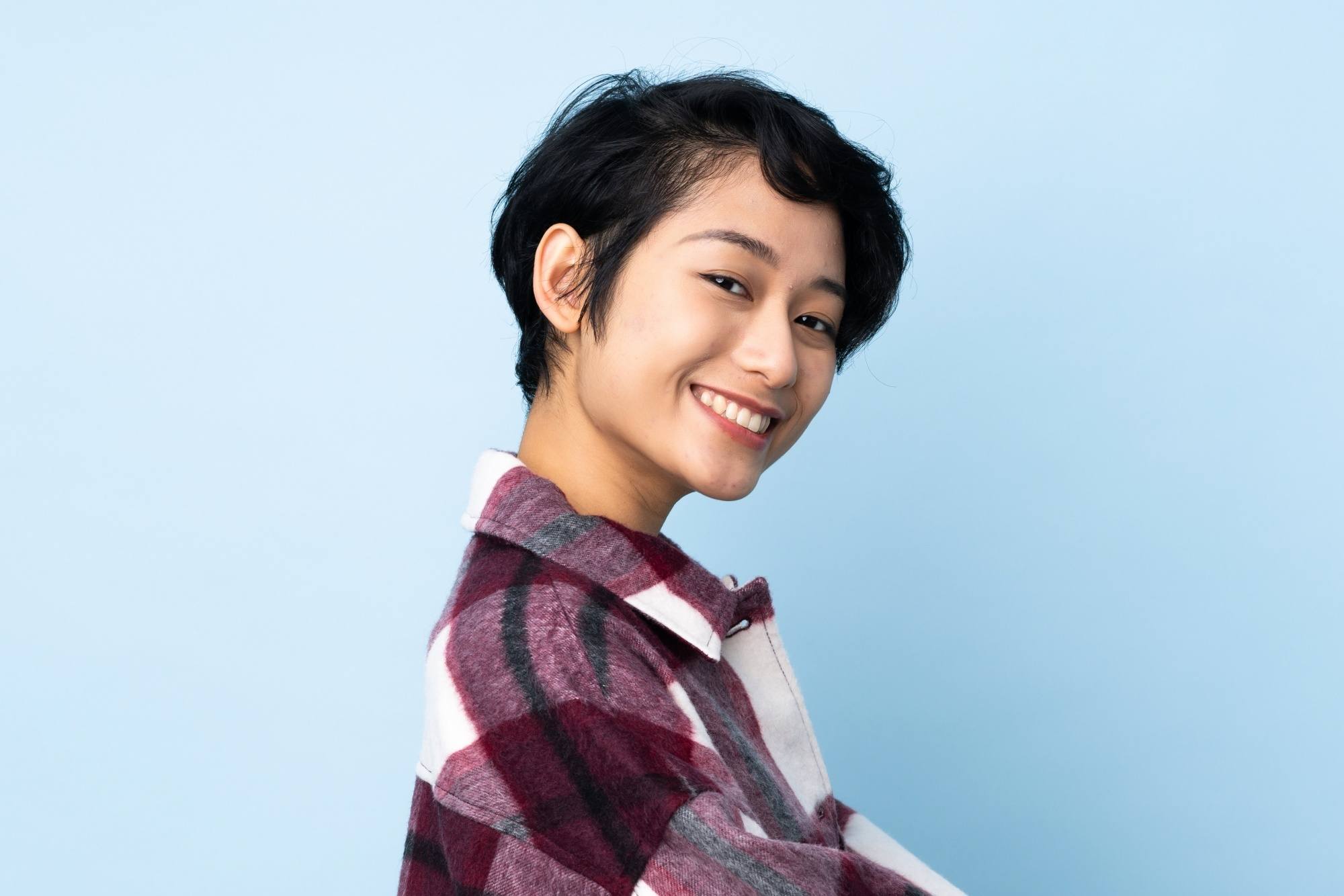 Asian woman with a pixie cut for wavy hair