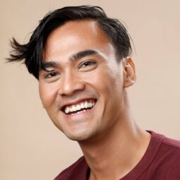 Asian man with short wavy hairstyle