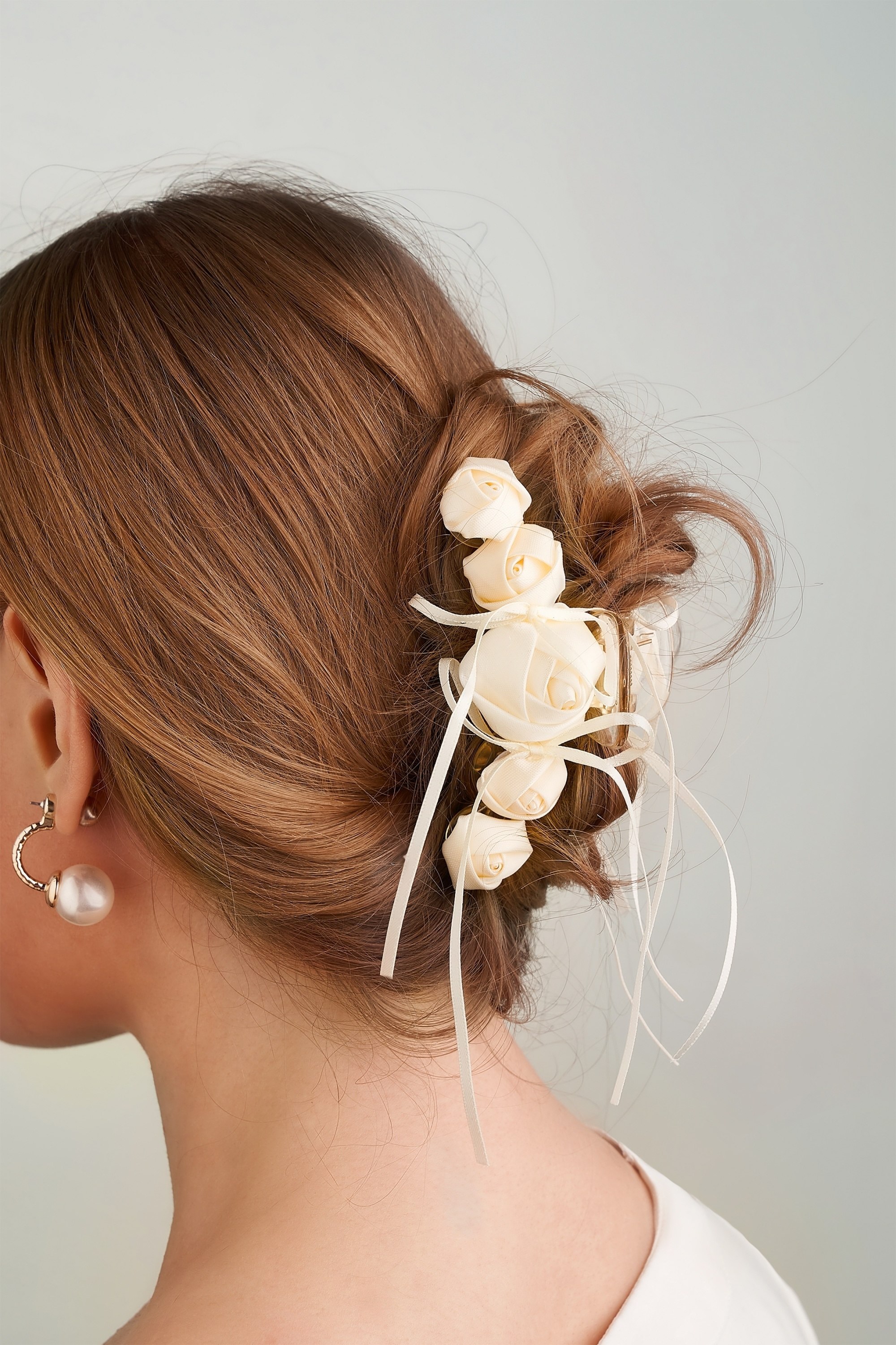 Closeup shot of a back of woman's head with an updo secured by a hair claw.