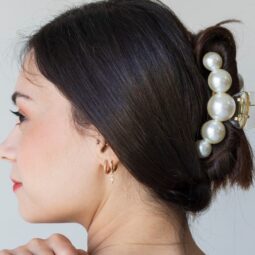Woman with hair in an updo secured by a hair claw.